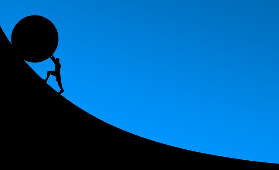 Pushing a boulder uphill